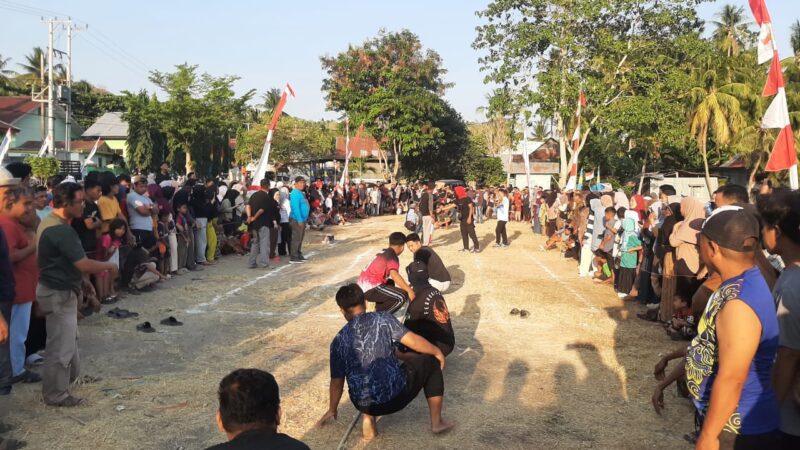 Bhabinkamtibmas Polsek Banggae Pantau Lomba Rakyat