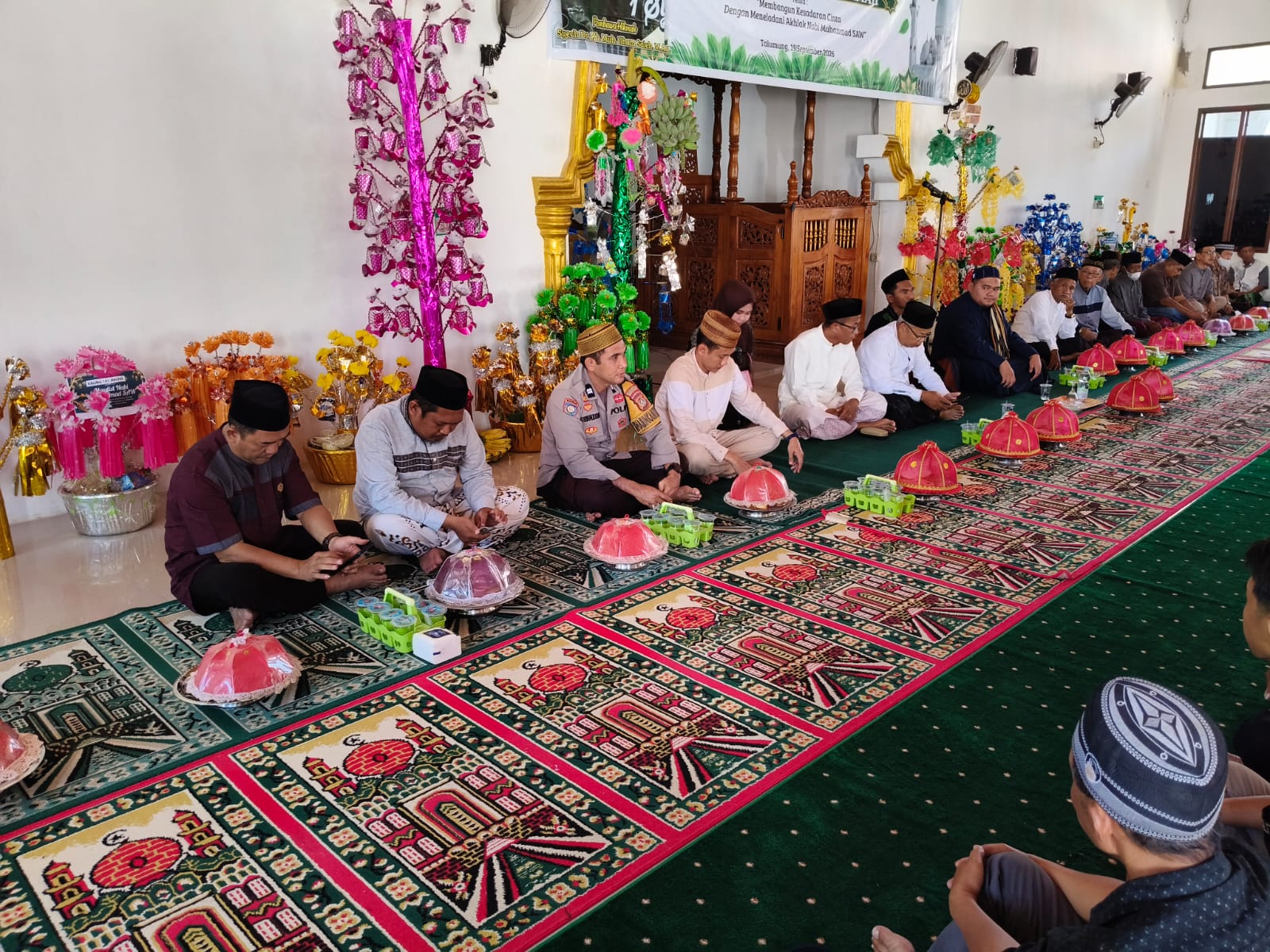 Bhabinkamtibmas Polsek Banggae Hadiri Maulid Nabi di Talumung